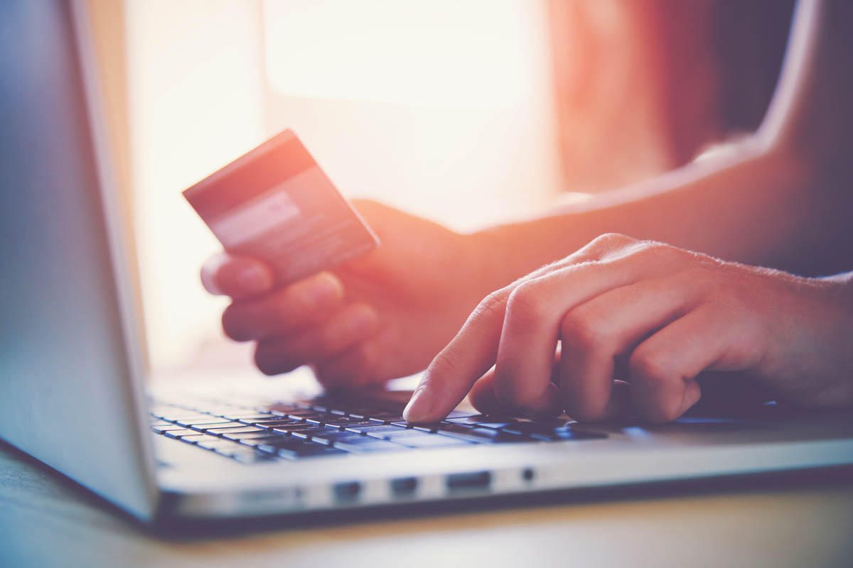 Online shopping with credit card and laptop